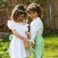 Linen Cross-Back Ruffle Flower Girl Dress with Green linen Bow and matching Pageboy outfit by Amelia Brennan